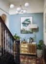 <p>Just because a hallway is a transitional space, doesn't mean it should be neglected when it comes to dressing with art or accessories.</p><p>'Always walk around the space and you will feel the natural spots for art to be,' says Camilla Clarke, Creative Director at interior design studio <a href="https://albion-nord.com/" rel="nofollow noopener" target="_blank" data-ylk="slk:Albion Nord;elm:context_link;itc:0" class="link ">Albion Nord</a>. 'This may be next to a window or at the end of a corridor. Remember art doesn’t always need to be hung on the centre of the wall it can rest on top of tables or layered next to sculptures or on bookshelves and joinery.' </p>
