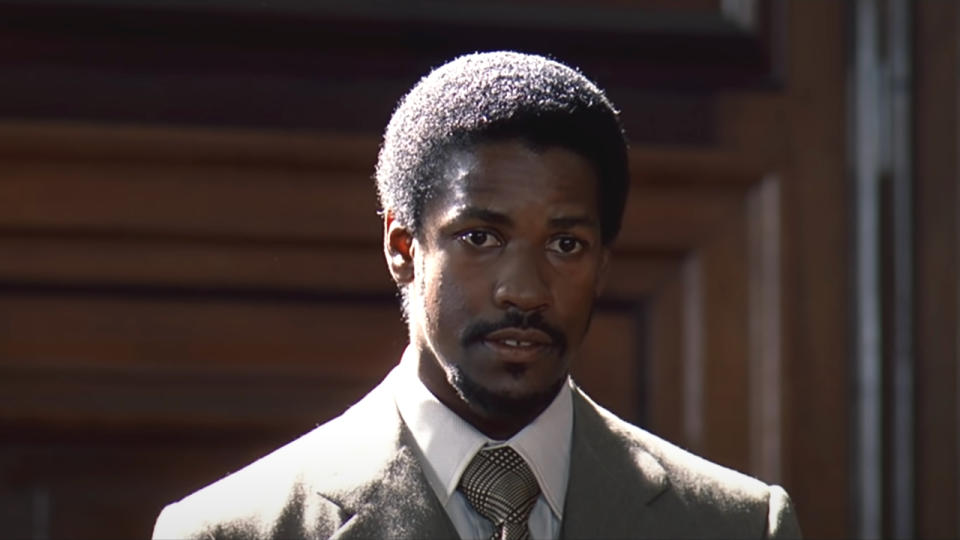 Denzel Washington sitting in the middle of testimony in Cry Freedom.