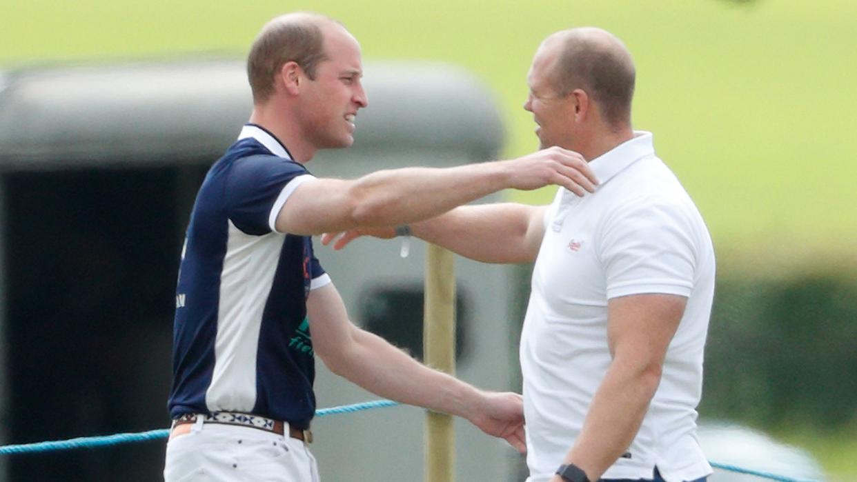 Prince William and Mike Tindall going in for a hug