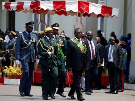 Zimbabwe's President Emmerson Mnangagwa arrives to officially open a new parliament session as well as deliver his State of the Nation address at Parliament Building in Harare