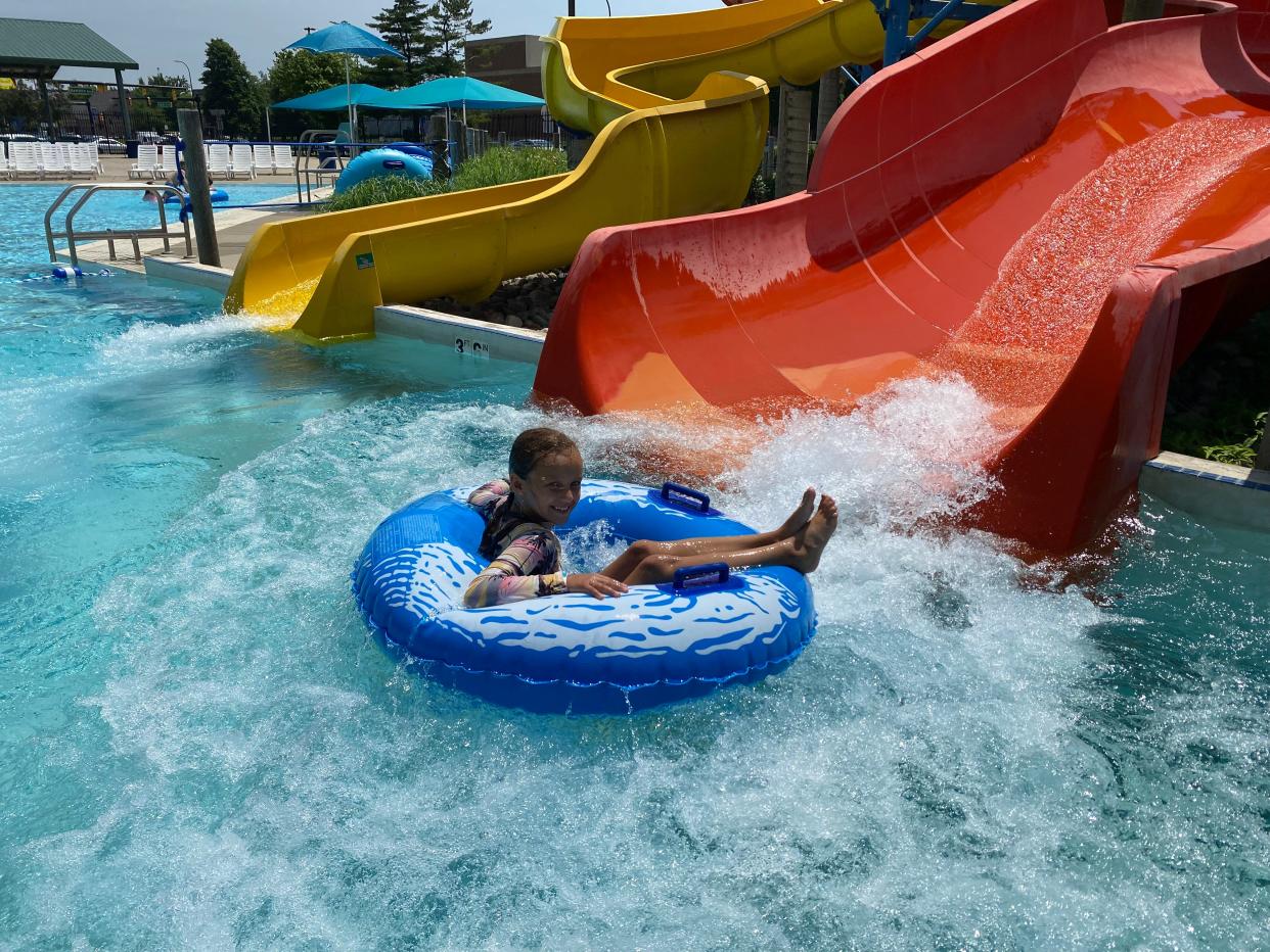 Emerson Porter comes out of a tube slide at Flash Flood Water Park in downtown Battle Creek Monday, June 13, 2022.