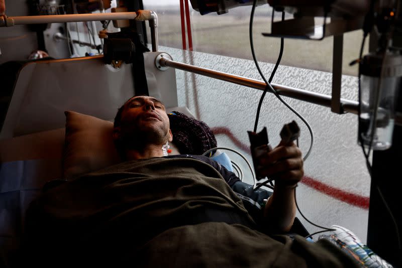 Ukrainian volunteer medics use a converted bus to transport wounded Ukrainian soldiers from the eastern frontline near Bakhmut to a hospital in Dnipro