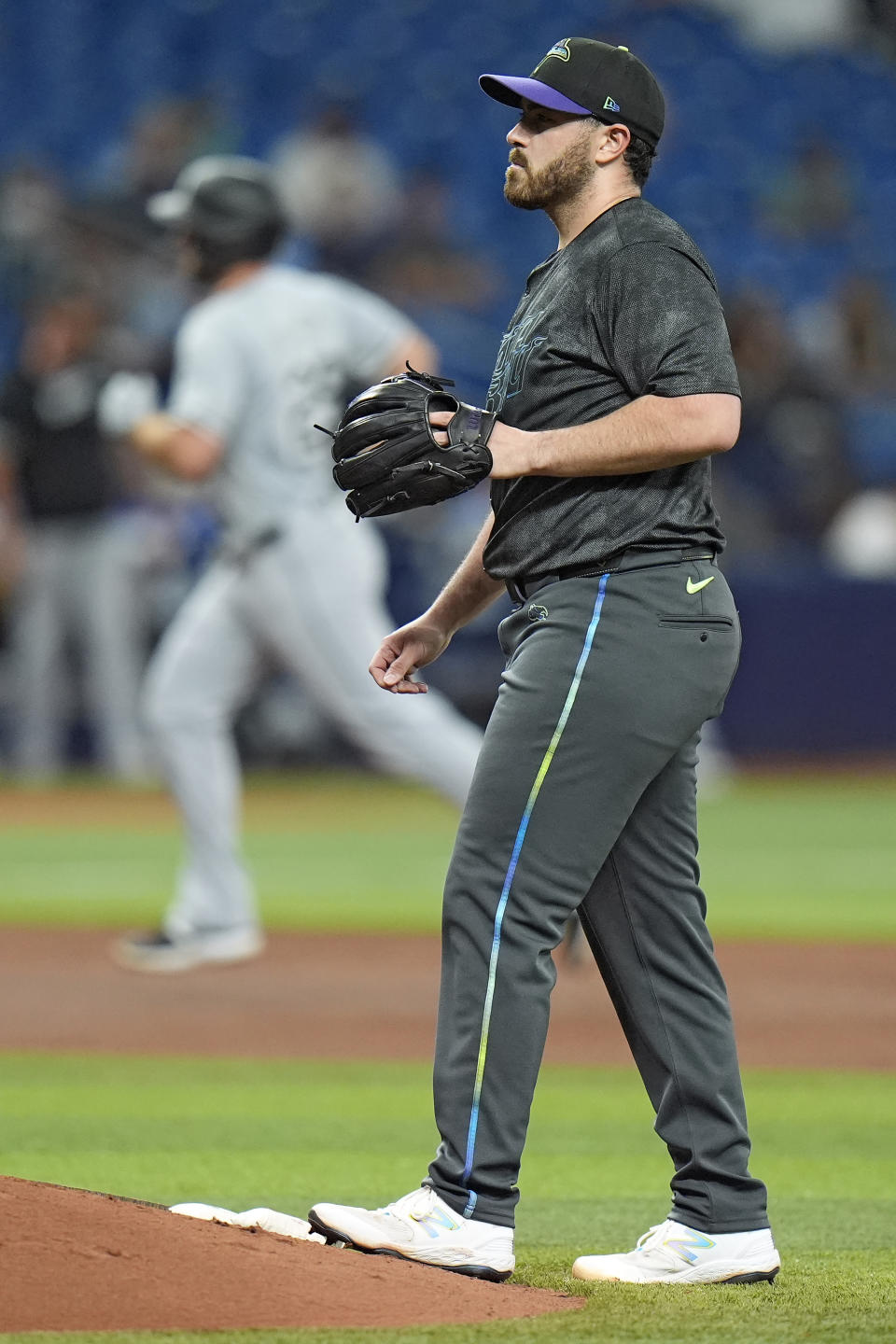 Tampa Bay Rays starting pitcher Aaron Civale waits for a new baseball as Chicago White Sox's Paul DeJong runs around the bases after his two-run home run during the fifth inning of a baseball game Wednesday, May 8, 2024, in St. Petersburg, Fla. (AP Photo/Chris O'Meara)