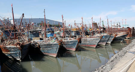 Chinese fishing boats captured by South Korean coast guard are seen at a port in Incheon, South Korea, October 10, 2016. Yoon Tae-hyun/Yonhap via REUTERS