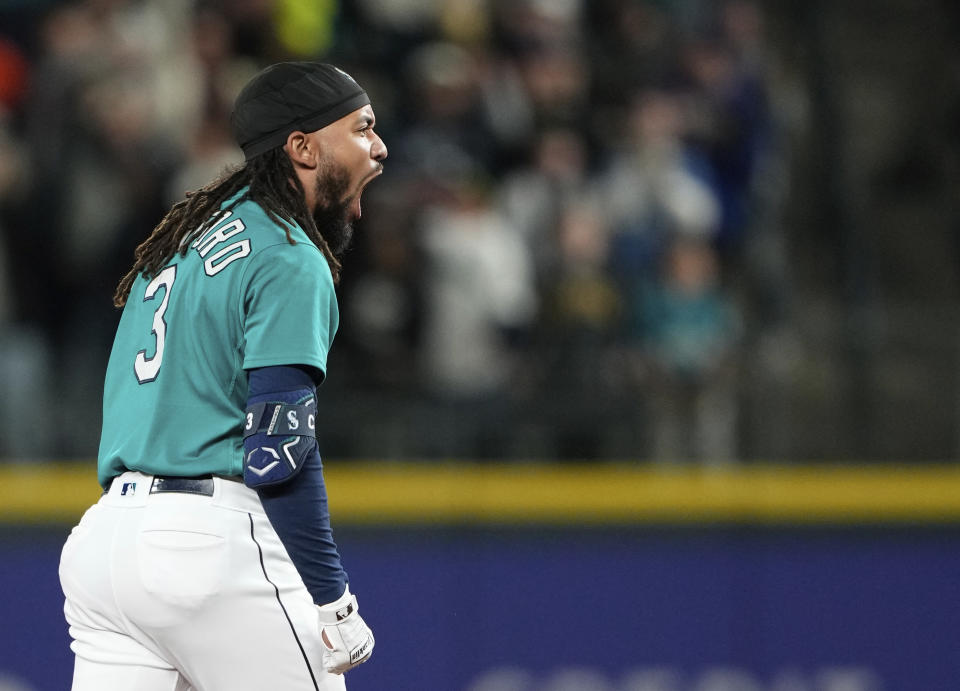 Seattle Mariners' J.P. Crawford reacts after hitting a three-run double against the Houston Astros during the eighth inning of a baseball game Saturday, May 6, 2023, in Seattle. (AP Photo/Lindsey Wasson)