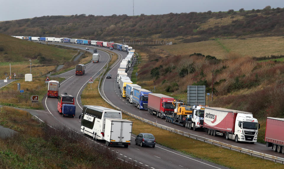 Lorries queue on the A20 to enter the port of Dover in Kent. Christmas stockpiling and Brexit uncertainty have again caused huge queues of lorries to stack up in Kent. The latest delays came as the UK marked less than two weeks until 2021 and the end of the Brexit transition period. (Photo by Gareth Fuller/PA Images via Getty Images)