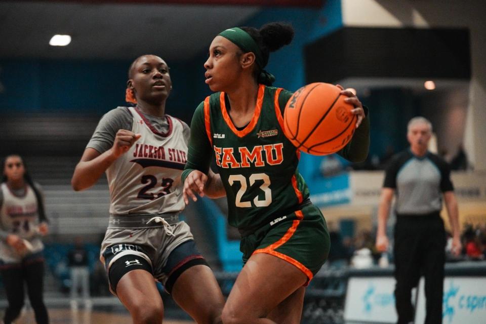 Florida A&M University women's basketball guard Dylan Horton (23) looks to make a play against Jackson State guard Ja'Leah Hickmon at Lee E. Williams Athletic and Assembly Center, Jackson, Mississippi, Monday, Jan. 23, 2023