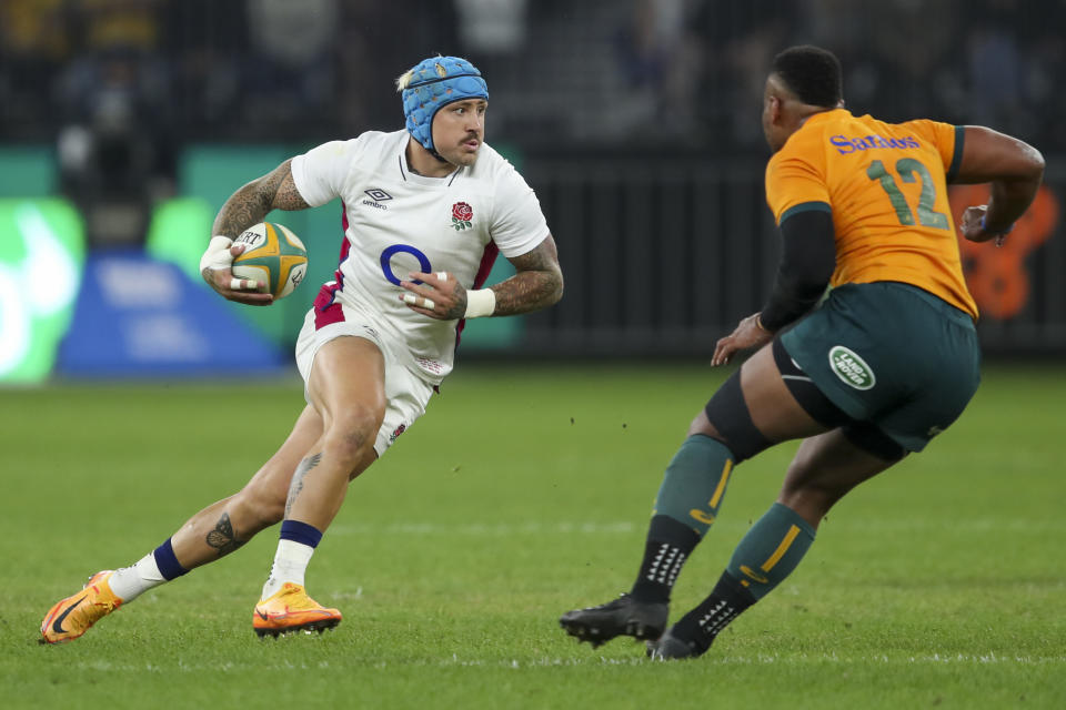 England's Jack Nowell runs at Australia's Samu Kerevi, right, during the rugby international between England and the Wallabies in Perth, Australia, Saturday, July 2, 2022. (AP Photo/Gary Day)