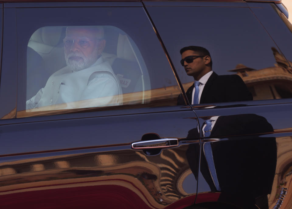 Indian Prime Minister Narendra Modi arrives at the Indian presidential palace to receive German Chancellor Olaf Scholz, for latter's ceremonial reception, in New Delhi, India, Saturday, Feb. 25, 2023. (AP Photo/Manish Swarup)