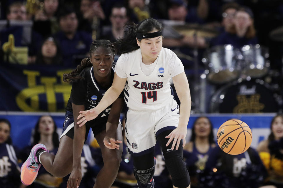 Gonzaga guard Kayleigh Truong and UC Irvine guard Deja Lee, right, go after the ball during the second half of a first-round college basketball game in the women's NCAA Tournament in Spokane, Wash., Saturday, March 23, 2024. (AP Photo/Young Kwak)