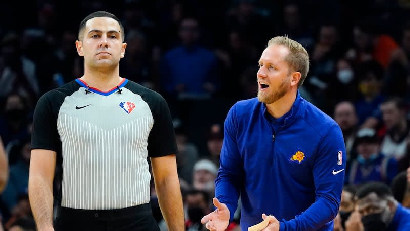 Phoenix Suns assistant coach Kevin Young, right, argues with a referee during game against the Oklahoma City Thunder Wednesday, Dec. 29, 2021, in Phoenix. On Tuesday, April 16, 2024, BYU announced it has hired him as its new head coach.