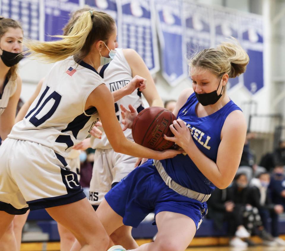 Norwell's Sara Cashin battles for control of the basketball next to Rockland defender Maddie Murphy during a game on Tuesday, Jan. 25, 2022.