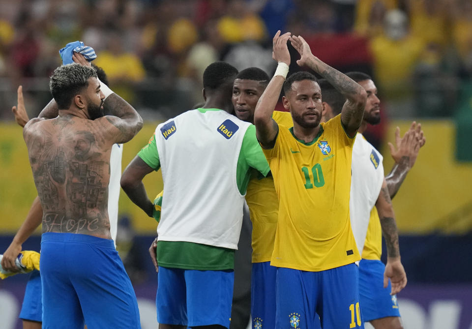 Brazil's Neymar, right, celebrates at the end of a qualifying soccer match for the FIFA World Cup Qatar 2022 against Uruguay at Arena da Amazonia in Manaus, Brazil, Thursday, Oct.14, 2021. Brazil won 4-1. (AP Photo/Andre Penner)