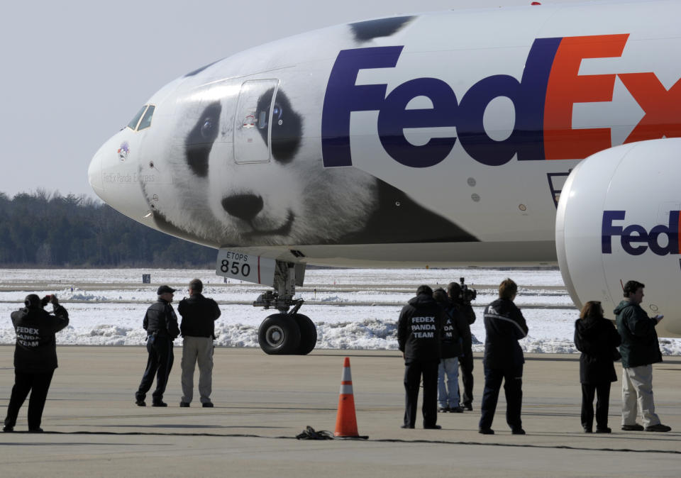 FILE - People watch as the plane carrying giant pandas Mei Lan of Atlanta, and Tai Shan of Washington, taxi for departure for a trip to China, Feb. 4, 2010, in Chantilly, Va. Panda lovers in America received a much-needed injection of hope Wednesday, Nov. 15, 2023, as Chinese President Xi Jinping said his government was “ready to continue” loaning the black and white icons to American zoos. (AP Photo/Susan Walsh, File)