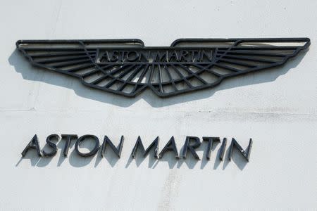 FILE PHOTO: The Aston Martin logo is seen at a car repair workshop in Beijing, China June 19, 2017. REUTERS/Thomas Peter/File Photo