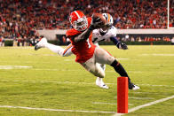 ATHENS, GA - NOVEMBER 12: Isaiah Crowell #1 of the Georgia Bulldogs dives for a touchdown past Erique Florence #14 of the Auburn Tigers at Sanford Stadium on November 12, 2011 in Athens, Georgia. (Photo by Kevin C. Cox/Getty Images)