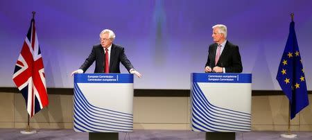 The European Union's chief Brexit negotiator Michael Barnier (R) and Britain's Secretary of State for Exiting the European Union David Davis speak at the European Commission after the first day of Brexit talks in Brussels, Belgium, June 19, 2017. REUTERS/Francois Lenoi/Files