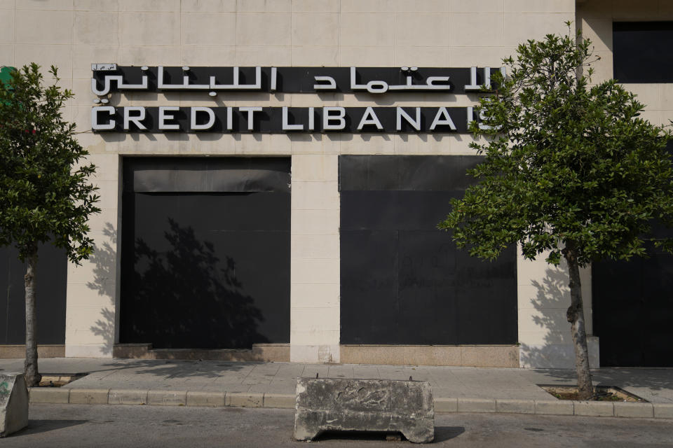 The facade of a closed Credit Libanais Bank branch is covered with metal sheets to prevent acts of sabotage in Beirut, Lebanon, Tuesday, Sept. 20, 2022. Lebanese banks closed their doors for three days on Sept. 19 to protest recent attacks and heists by depositors demanding their trapped savings. (AP Photo/Hassan Ammar)