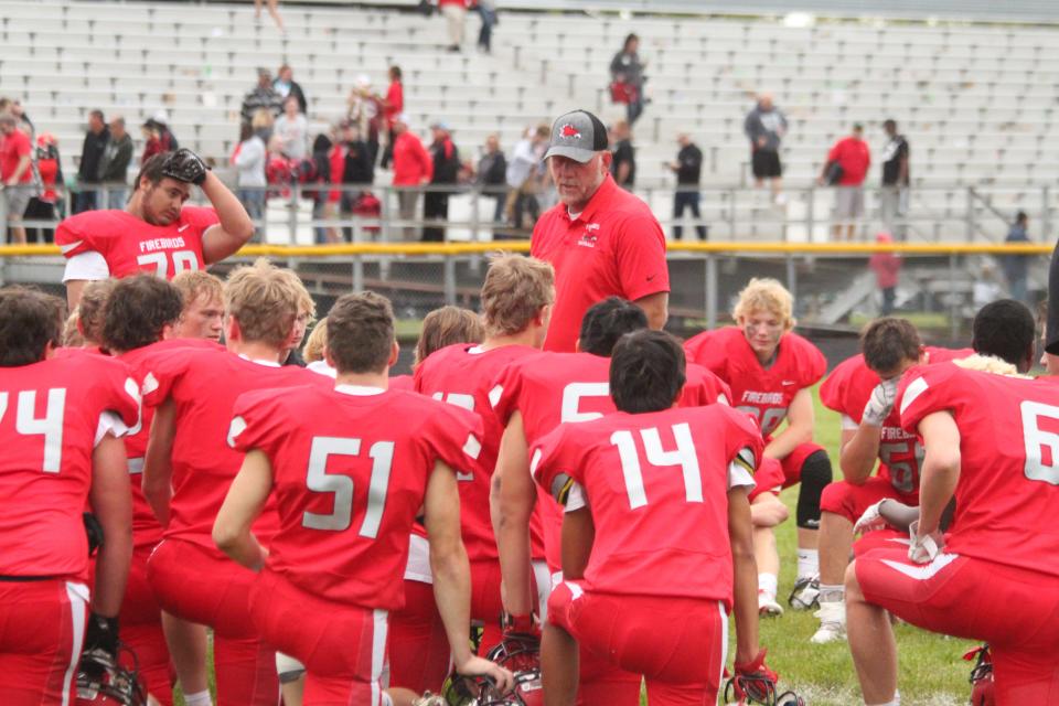 Todd Lambrecht (center) sees Caleb Schneider's involvement in the 2022 North Dakota Shrine Bowl as one of growth for the player and the program as a whole.