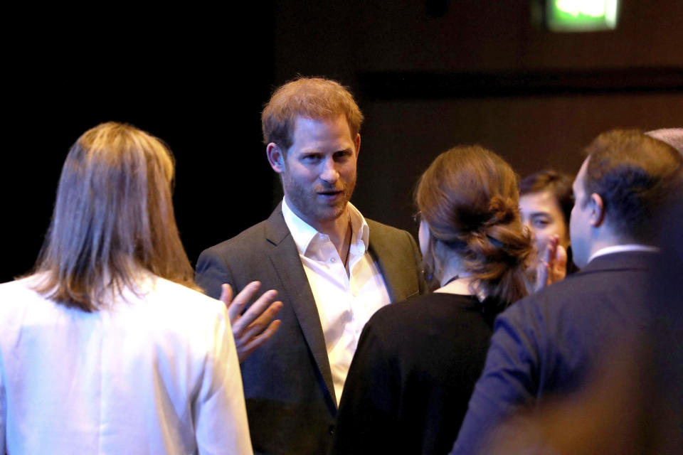 Britain's Prince Harry, centre, speaks, during a sustainable tourism summit at the Edinburgh International Conference Centre in Edinburgh, Scotland, Wednesday, Feb. 26, 2020. (Andrew Milligan/Pool Photo via AP)