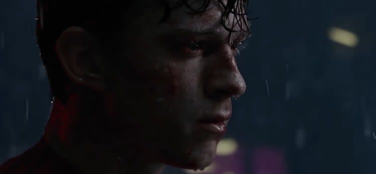 A sad Peter standing in the rain in "Spider-Man: No Way Home"