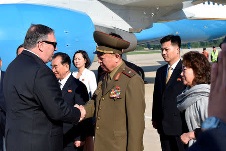 U.S. Secretary of State Mike Pompeo greets an unidentified North Korean general on arrival at the Pyongyang, North Korea, May 9, 2018. Matthew Lee/Pool via REUTERS