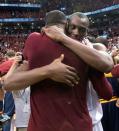 May 27, 2016; Toronto, Ontario, CAN; Toronto Raptors center Bismack Biyombo (8) hugs Cleveland Cavaliers center Tristan Thompson (13) at the end of game six of the Eastern conference finals of the NBA Playoffs against the Toronto Raptors at Air Canada Centre. The Cleveland Cavaliers won 113-87. Mandatory Credit: Nick Turchiaro-USA TODAY Sports