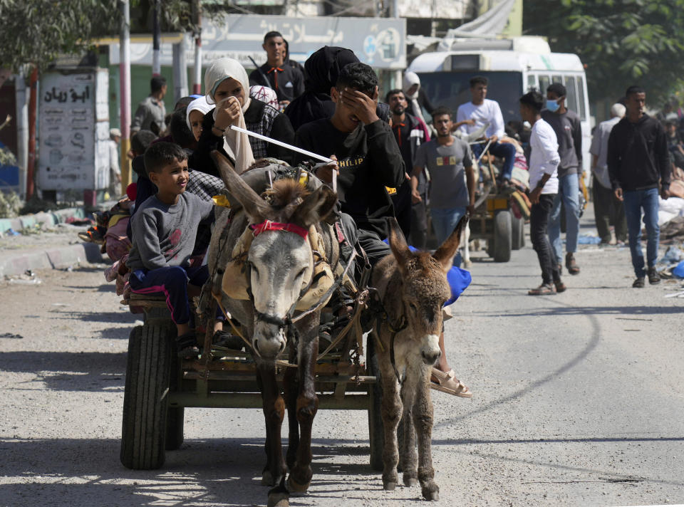 Palestinians flee from northern Gaza to the south after the Israeli army issued an unprecedented evacuation warning to a population of over 1 million people in northern Gaza and Gaza City to seek refuge in the south ahead of a possible Israeli ground invasion, Friday, Oct. 13, 2023. (AP Photo/Hatem Moussa)