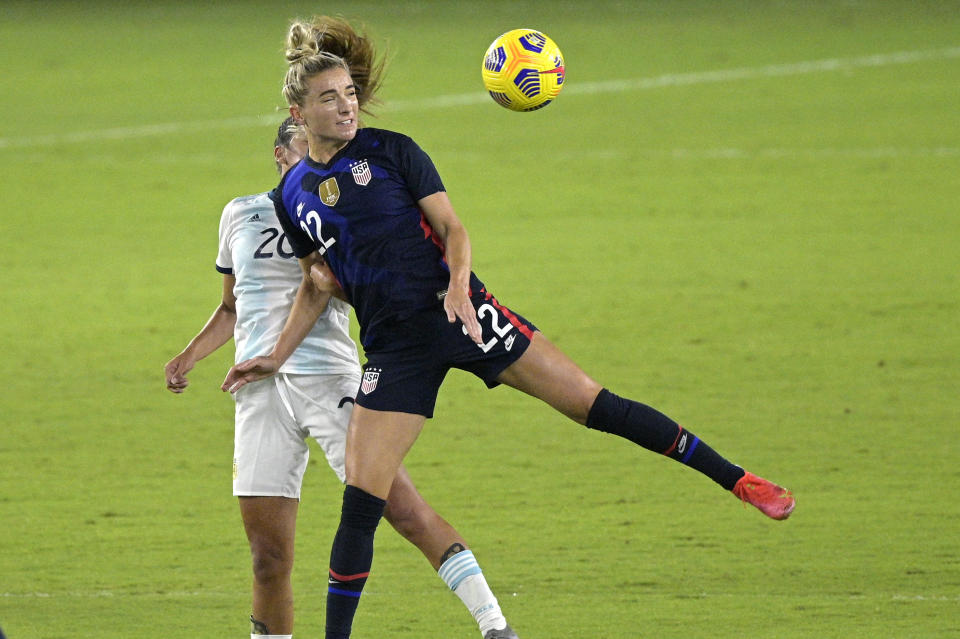 United States midfielder Kristie Mewis (22) and Argentina midfielder Daiana Falfan (20) compete for a header during the first half of a SheBelieves Cup women's soccer match, Wednesday, Feb. 24, 2021, in Orlando, Fla. (AP Photo/Phelan M. Ebenhack)