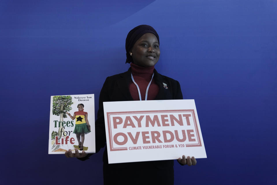 Nakeeyat Dramani Sam, of Ghana, poses for photos at the COP27 U.N. Climate Summit, Friday, Nov. 18, 2022, in Sharm el-Sheikh, Egypt. She made a plea for negotiators at the summit to come to an agreement that could help curb global warming. (AP Photo/Nariman El-Mofty)