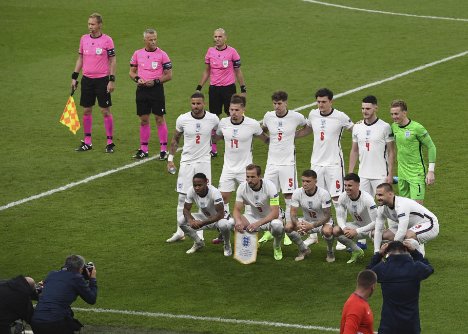 England players pose ahead of the Euro 2020 final soccer match between Italy and England at Wembley stadium in London, Sunday, July 11, 2021. (Facundo Arrizabalaga/Pool via AP)