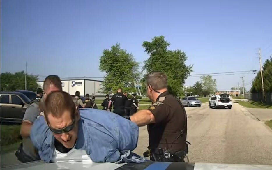 Casey Cole White, in custody after a brief chase and crash ended his 11 days on the run with Lauderdale County jailer Vicky Sue White, in a screenshot from body camera footage released by the Evansville Police Department.