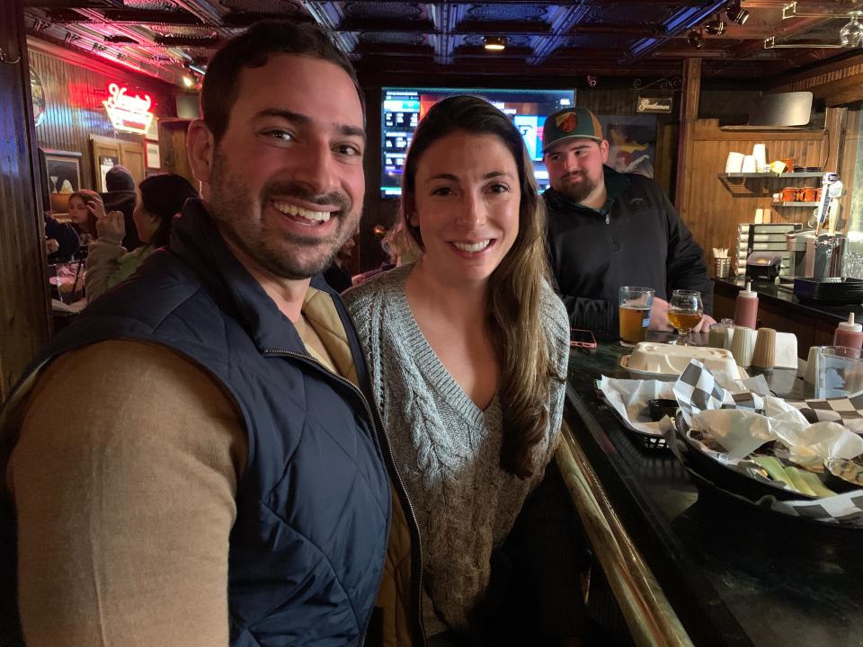 Cory Zale and Amelia DeAntonis, of East Aurora, New York, at Bar-Bill Tavern in East Aurora, New York, on Jan. 28, 2022. The couple, die-hard fans of the Buffalo Bills, talked about the scars of their Bills fandom and how they will never abandon their team. Said Zale: u0022It doesn't matter how good or bad the Bills are. Everybody's there. Everybody's emotionally invested.u0022