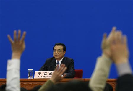 China's Premier Li Keqiang takes questions during a news conference, after the closing ceremony of the Chinese National People's Congress (NPC) at the Great Hall of the People, in Beijing March 13, 2014. REUTERS/Kim Kyung-Hoon