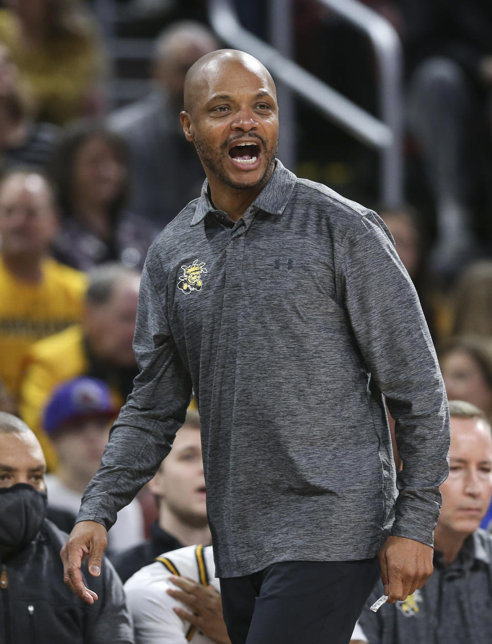 Wichita State coach Isaac Brown yells instructions to his team during the first half of an NCAA college basketball game against Kansas State, Sunday, Dec. 5, 2021, in Wichita, Kan. (Travis Heying/The Wichita Eagle via AP)