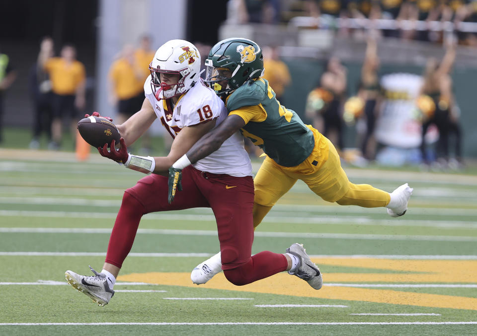 Iowa State tight end Benjamin Brahmer (18) catches a pass against Baylor safety Devyn Bobby (28) in the first half of an NCAA college football game, Saturday, Oct. 28, 2023, in Waco, Texas. (Jerry Larson/Waco Tribune-Herald via AP)