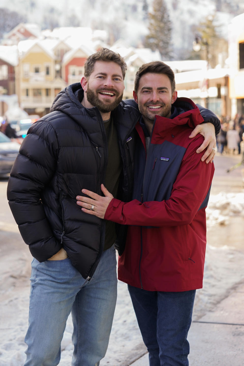 jonathan and his husband outside in the snow