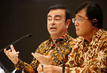 Chairman of Japanese car makers Mitsubishi Motors Corp (MMC) and Nissan Motor Co Ltd Carlos Ghosn (L) and Mitsubishi CEO Osamu Masuko talk to reporters during a news confrence at the Mitsubishi car factory in Bekasi, West Java province, Indonesia April 25, 2017. REUTERS/Beawiharta