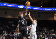 Stephen F. Austin guard Destini Lombard (4) blocks a shot by California Baptist forward Kinsley Barrington (3) during the first half of an NCAA college basketball game in the championship of the Western Athletic Conference women's tournament, Saturday, March 16, 2024, in Las Vegas. (AP Photo/David Becker)