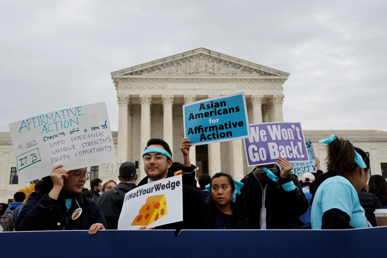 Demonstrators in front of the Supreme Court hold signs reading: We won’t go back.