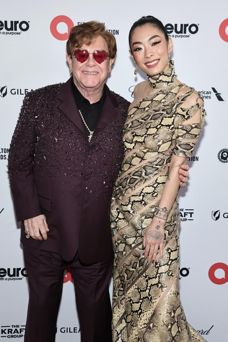 Elton John, left, and Rina Sawayama at his Academy Awards viewing party in West Hollywood, California, earlier this month.