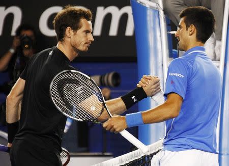 Novak Djokovic (R) of Serbia shakes hands Andy Murray of Britain after winning their men's singles final match at the Australian Open 2015 tennis tournament in Melbourne February 1, 2015. REUTERS/David Gray