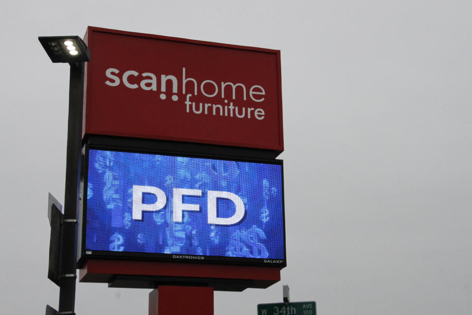 A furniture store in Anchorage, Alaska, advertises PFD sales Oct. 2, 2023, as the state plans to begin distributing $1,312 checks to nearly every Alaskan this week. The PFD, or the Permanent Fund dividend, is the annual share of the earnings from the state's nest-egg oil-wealth fund given to residents. (AP Photo/Mark Thiessen)