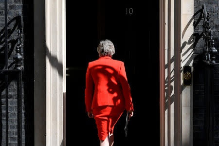 British Prime Minister Theresa May leaves after delivering a statement in London, Britain, May 24, 2019. REUTERS/Toby Melville