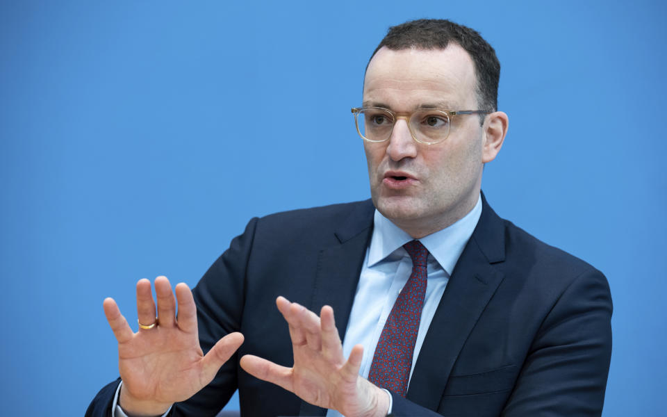 Acting German Health Minister Jens Spahn briefs the media on the current situation of the coronavirus pandemic in Berlin, Germany, Friday, Nov. 26, 2021. (Bernd von Jutrczenka/dpa via AP)