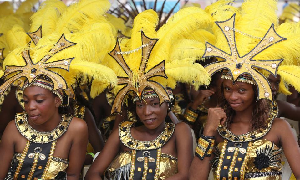 Performers walks through the street during Lagos Carnival in Lagos, Nigeria, Monday, April 1, 2013. Performers filled the streets of Lagos' islands Monday as part of the Lagos Carnival, a major festival in Nigeria's largest city during Easter weekend. (AP Photo/Sunday Alamba)