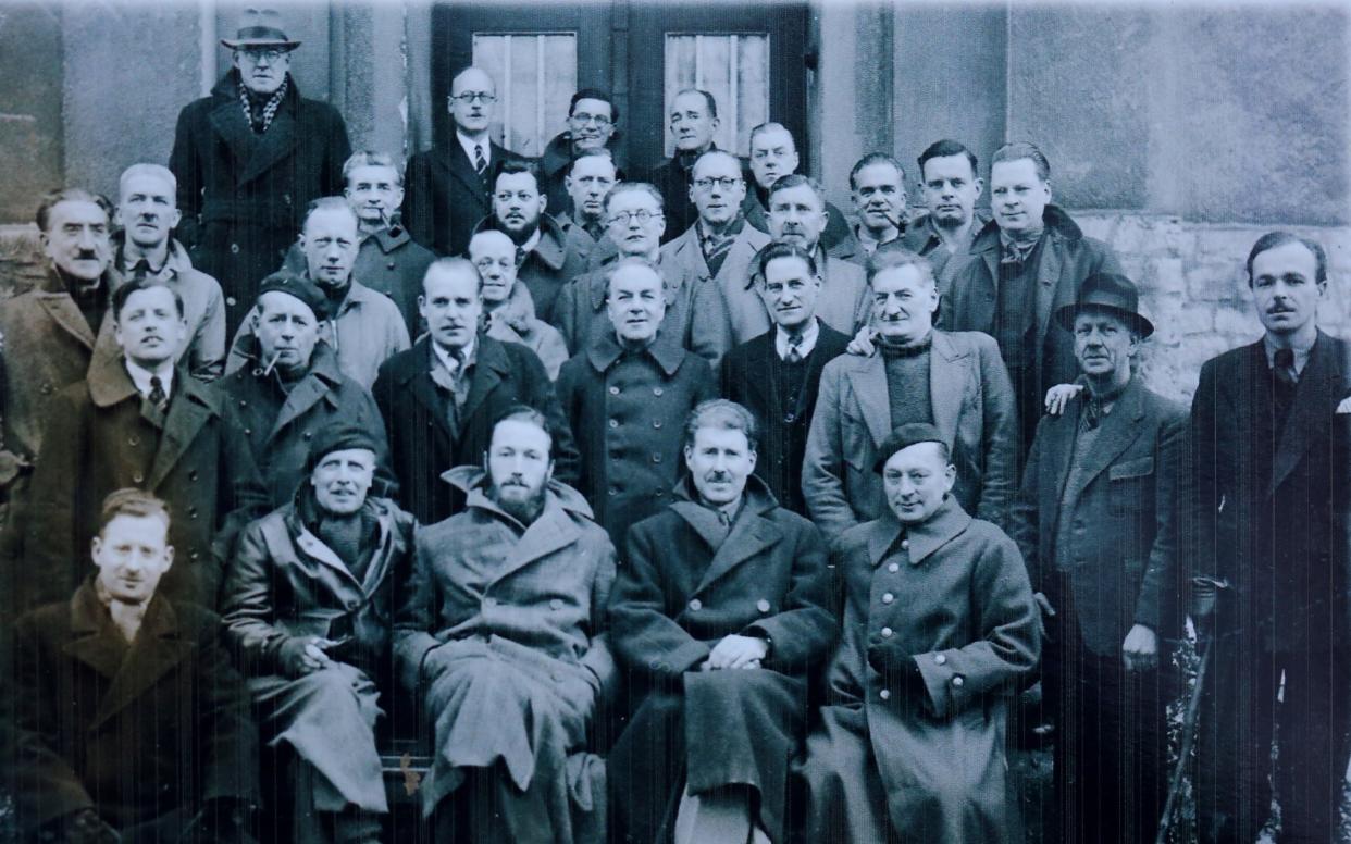 Collect photograph dated 1942 showing men in the Tost internment camp, in Upper Silesia. In the front row, seated on the right is Marina Gaskâ€™s grandfather Tom, and in the top left of the photograph is writer PG Wodehouse .