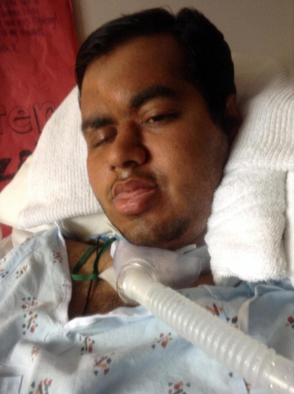 This 2014 photo provided by Shahraiz Bajwa taken at Essentia Health-St. Mary’s Medical Center in Duluth, Minn. shows Muhammad Shahzaib Bajwa, of Pakistan, who has been comatose since being injured in a November crash while spending a semester in an exchange program at the University of Wisconsin-Superior. His family is trying to prevent the hospital from sending him back to his home country. A hospital spokeswoman said Bajwa won’t be able to stay in the country legally after his student visa expires Feb. 28. (AP Photo/Courtesy Shahraiz Bajwa)