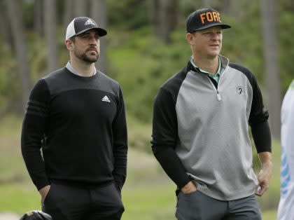 Packers QB Aaron Rodgers and Giants pitcher Matt Cain at the AT&T Pebble Beach Pro-Am. (AP)