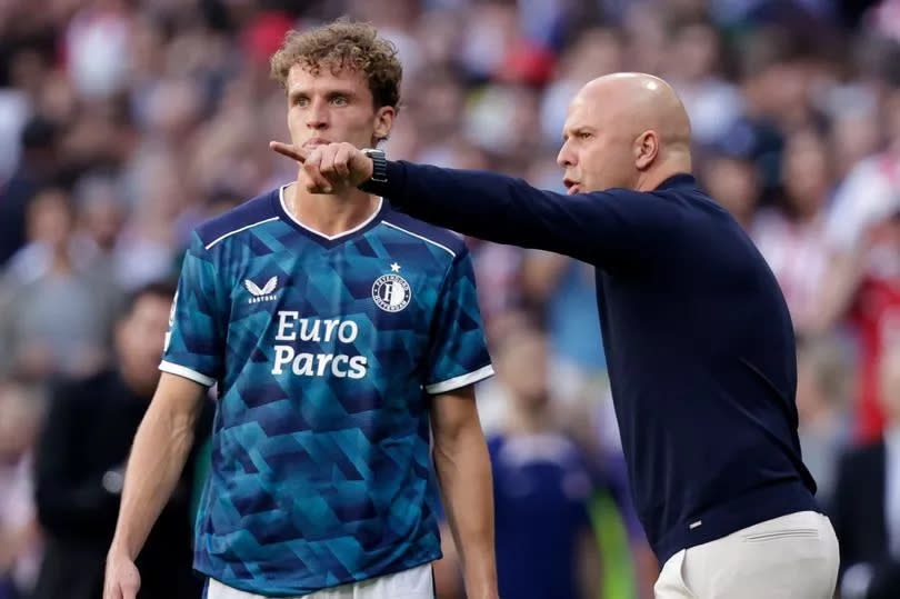 Mats Wieffer and coach Arne Slot of Feyenoord during the UEFA Champions League match between Atletico Madrid and Feyenoord at the Civitas Metropolitano Stadium on October 4, 2023 in Madrid Spain.